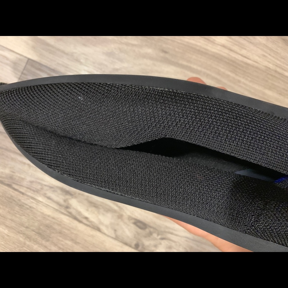 Rothy’s black pointed toe flats.